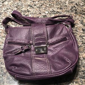Gently used purple purse with many compartments